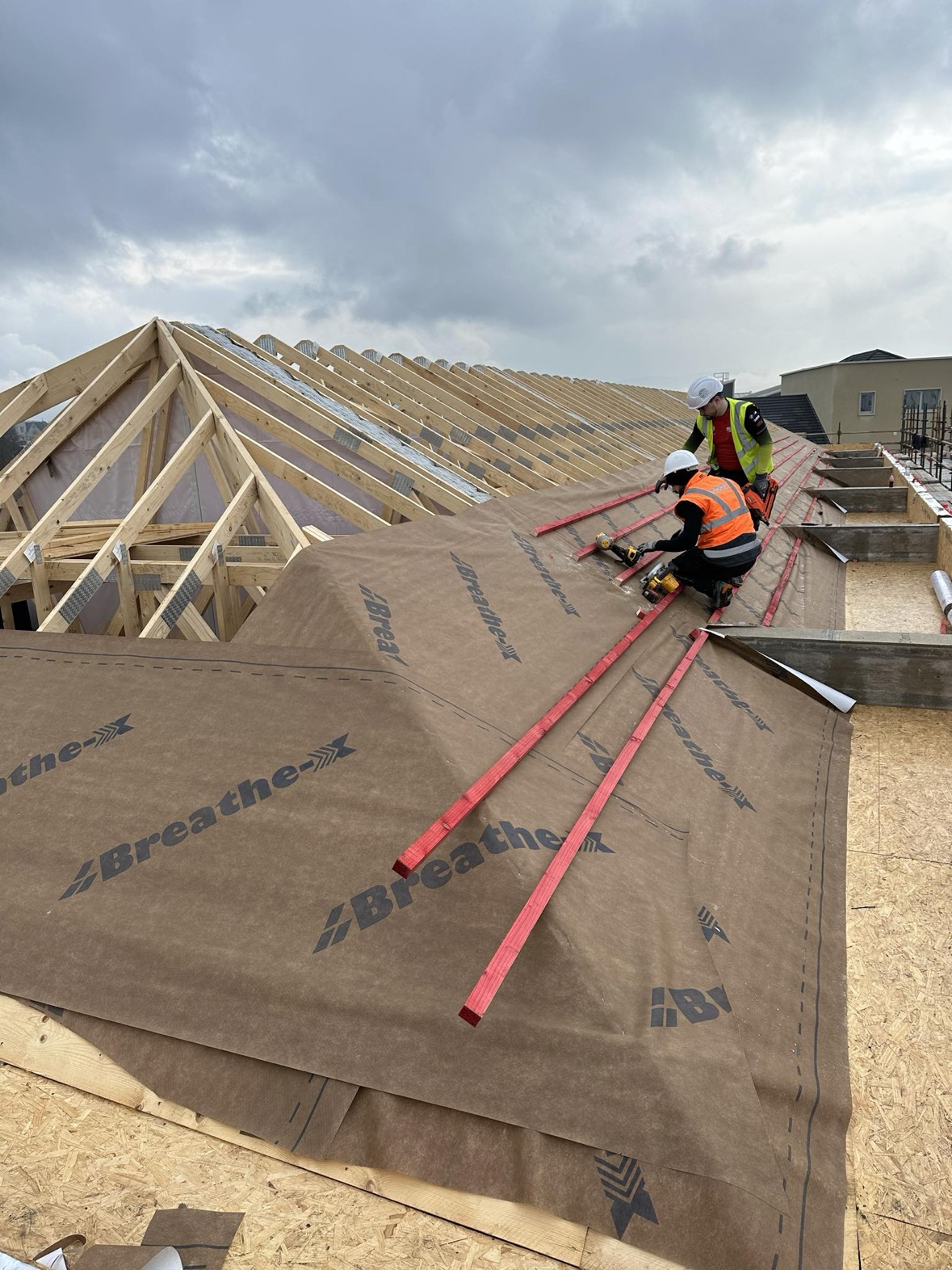 New pitched roof structure with underlay and battens being installed by Perfect Roofing