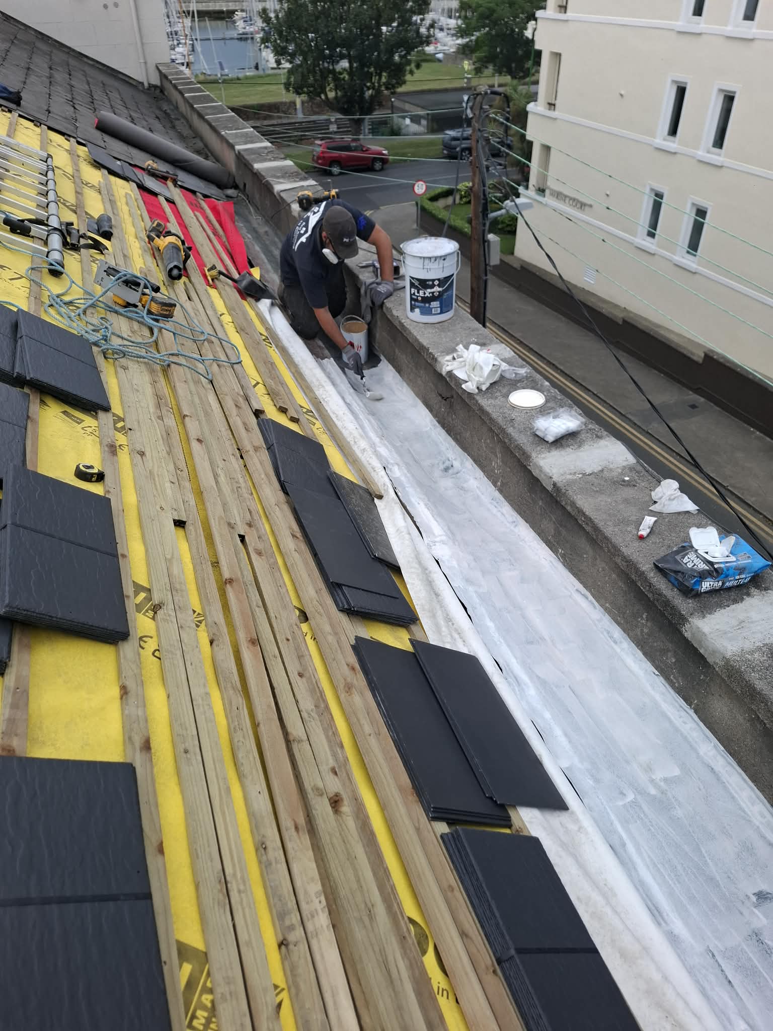 Perfect Roofing team carrying out real roof work on a pitched roof