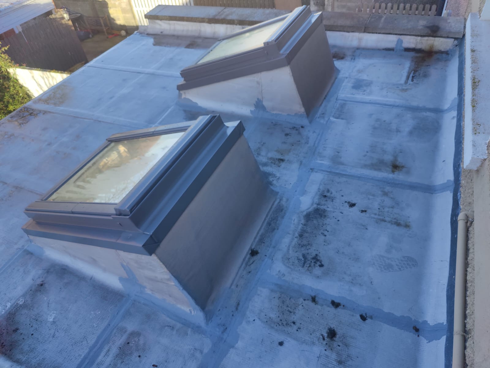 Velux flat roof windows with surrounding waterproofing detail by Perfect Roofing